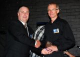 Prime Super Regional Manager, Scott Boyle presenting an Agriculture / Horticulture and associated services category finalist trophy to Cameron O’Phee from ICT International, Armidale.