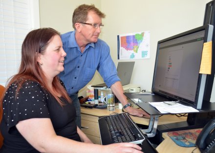 Regional Development Australia Northern Inland Finance and Project Officer Rebecca Wright and Senior Research Economist David Thompson monitor the non-farm business drought survey results.