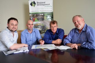 (L to R) James Pryor, Economist, Regional Development Australia Northern Inland Executive Director Nathan Axelsson, Senior Economist David Thompson and Chair, Russell Stewart examine the regional economic data.